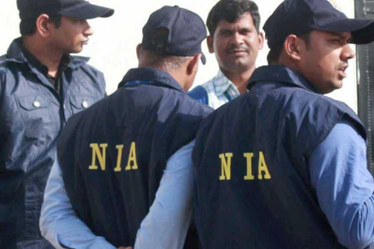 File image of NIA officials during a raid