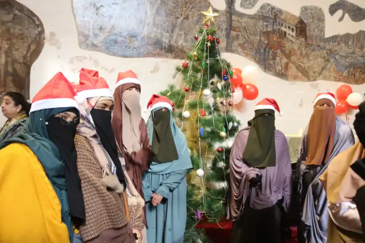 Kashmiri Muslim women posing with the Christmas Tree in Holy Family Church, Srinagar (Images: Basit Zargar)