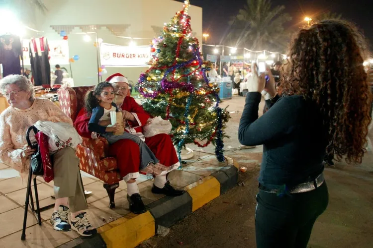 A child poses with Santa Clause in Riyadh, Saudi Arabia (Images Courtesy: Arab News)