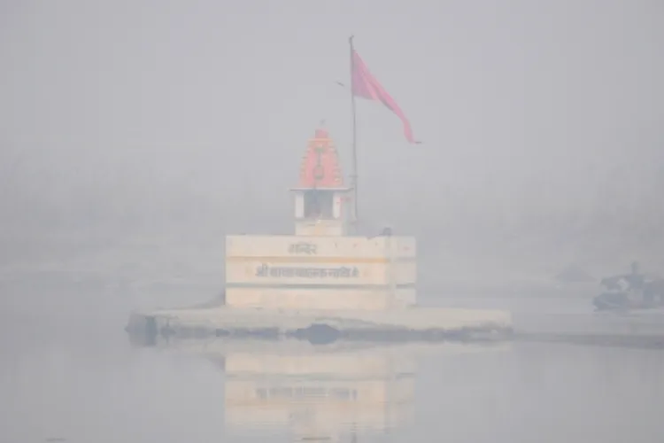 A temple looks hazy in the fog in Delhi