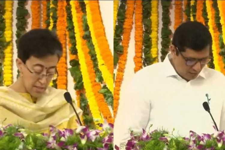 Atishi Marlena and Saurabh Bharadwaj taking oath as Ministers