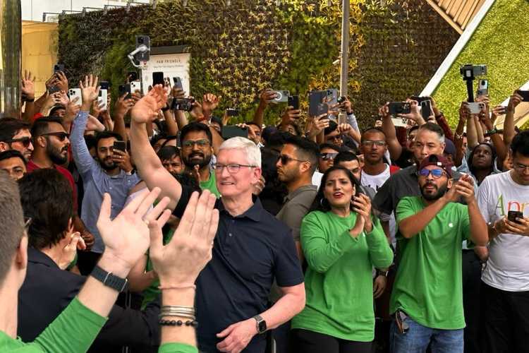 Tim Cook with employees of the Apple Retail store during its inauguration in Mumbai on Tuesday