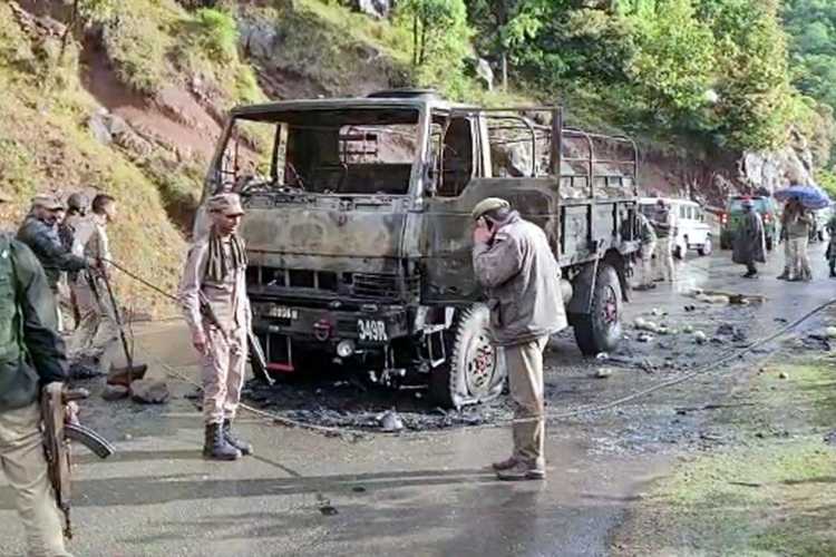 Police officials at the site of the terror attack