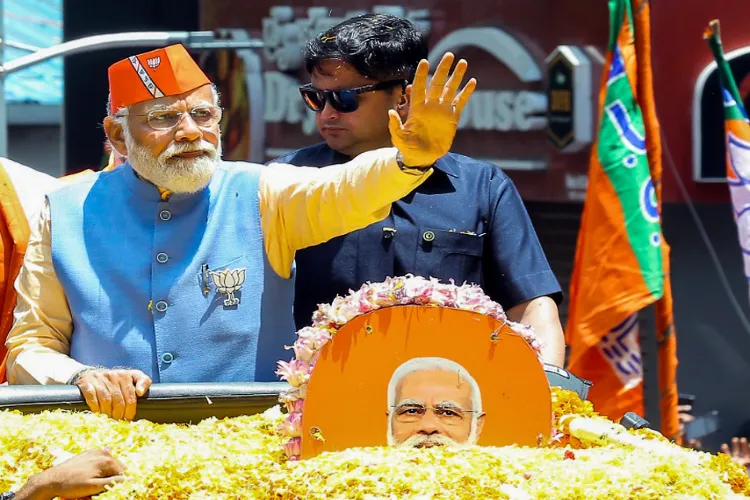 Prime Minister Narendra Modi on his Sunday roadshow in Bengaluru