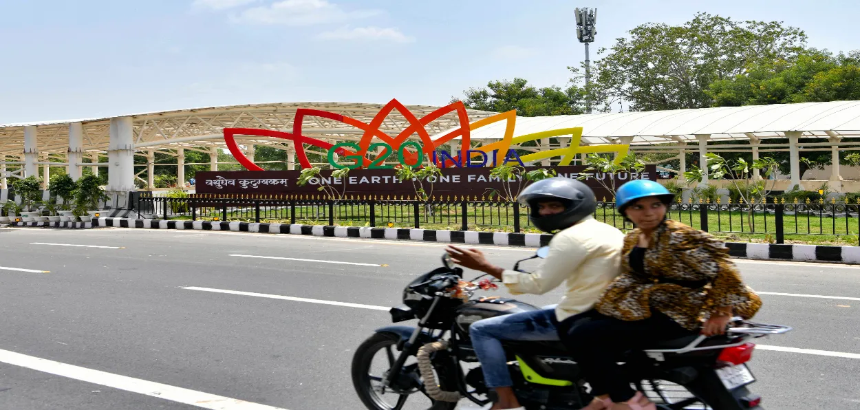 A couple passing by Mandapam, the venue of G-20 summit, in New Delhi