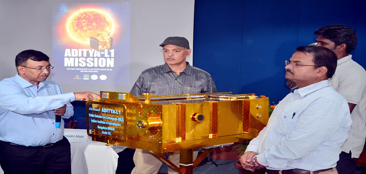 Scientists displaying a model of Aditya-L1 during a presser at Sriharikota