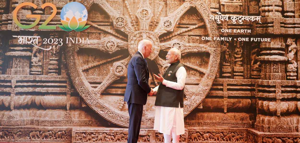 Prime Minister Narendra Modi welcoming President Joe Biden in front of the Konark week replica at the venue of the G-20 summit