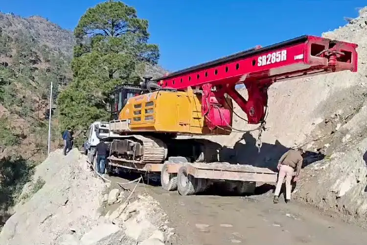 Machinery for drilling being taken atop the hill at Silkyara