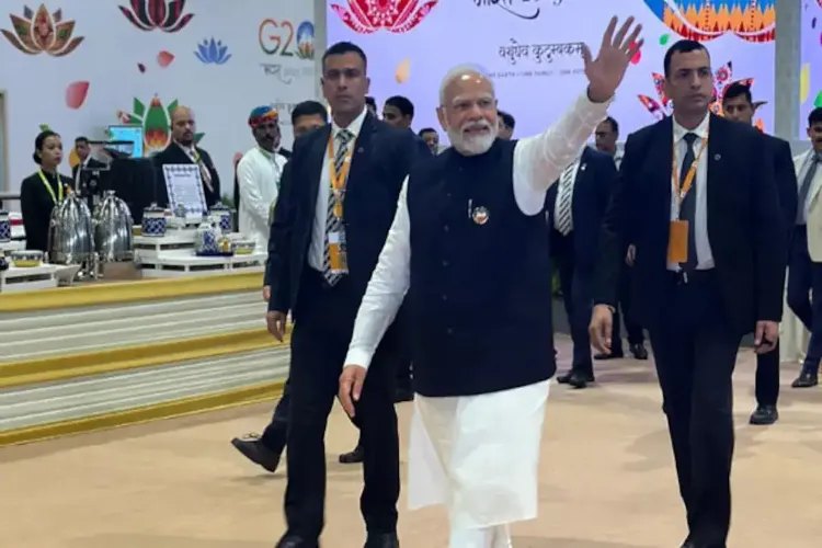 Prime Minister Narendra Modi waving at media persons