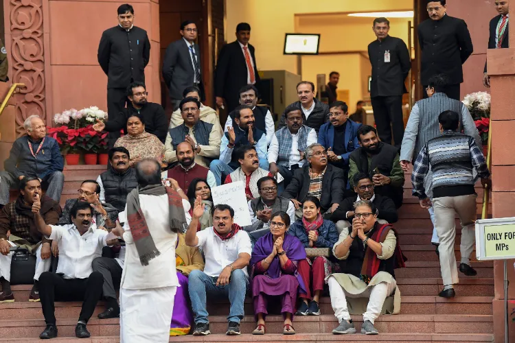 Some of the suspended MPs sitting in protest