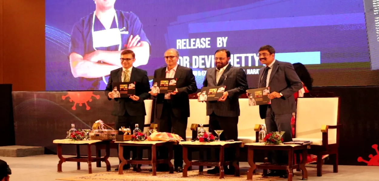 Dr Devi Shetty (Second from left) releasing Wasbir Hussain's (extreme left) book
