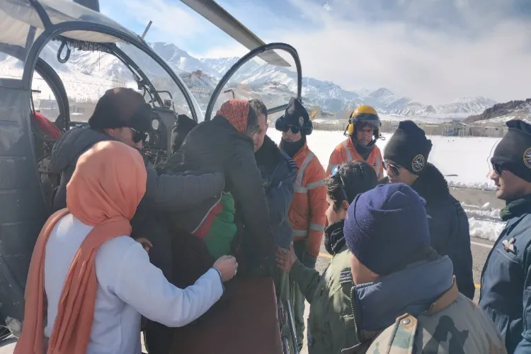 IAF personnel carrying out casualty evacuation of a senior citizen in Ladakh