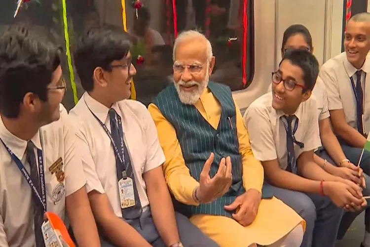 Prime Minister Narendra Modi enjoying a ride with school students in India's first underwater metro train