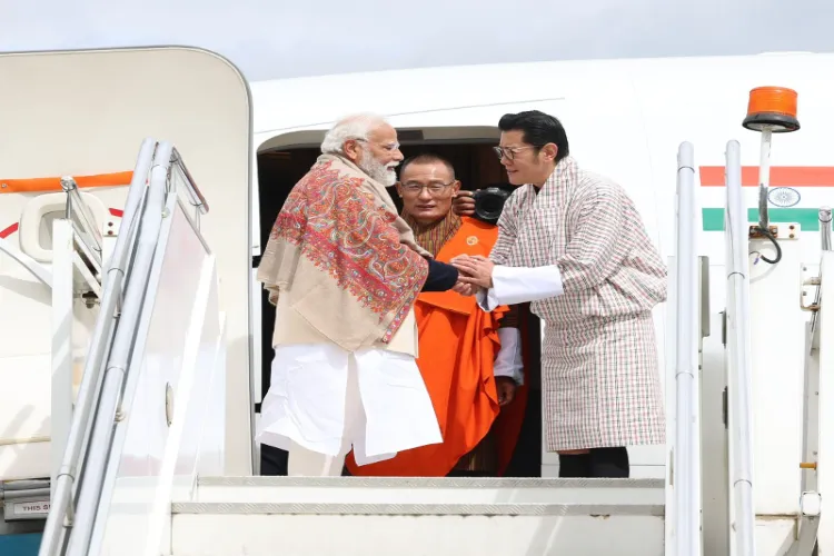 PM Narendra Modi thanking the Bhutanese King Jigme Khesar Namgyel Wangchuck and Bhutanese PM Dasho Tshering Tobgay while emplaning for Delhi