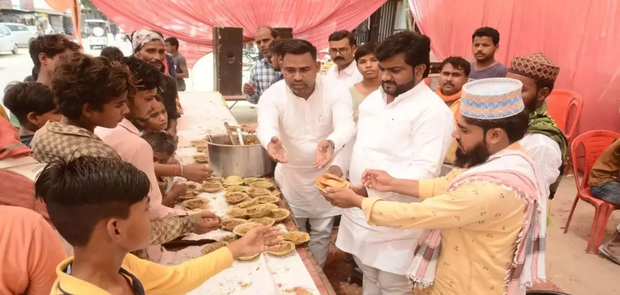 Hindus and Muslims distributing Prasad in Lucknow during the Bade Mangalvar festival 