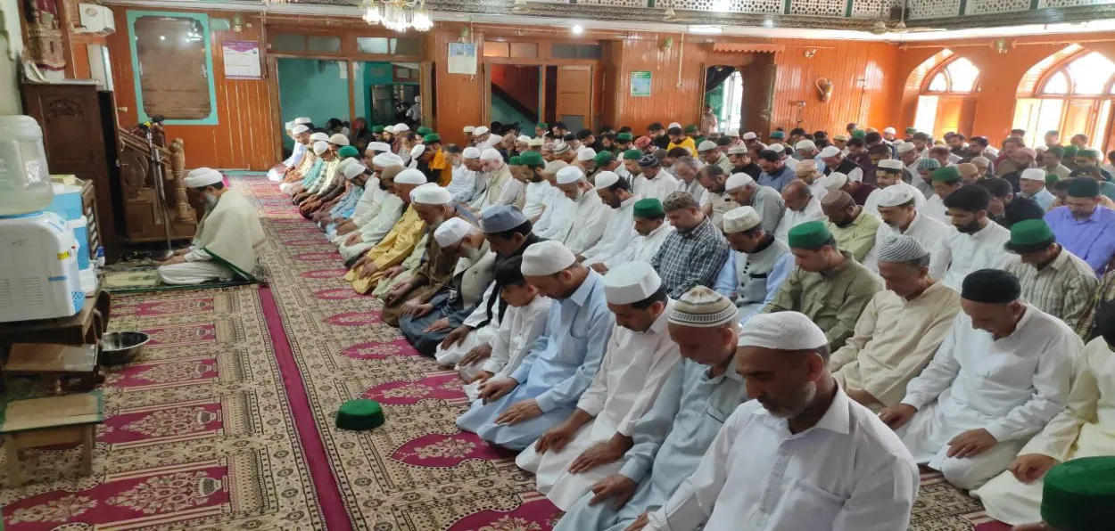Devoptees offering namaz in a mosque in Srinagar