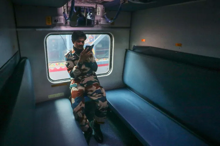 An army man using his mobile phone while travelling