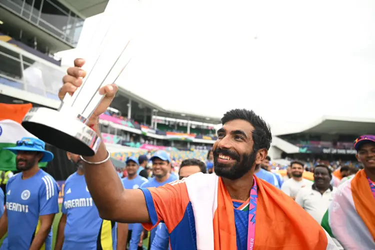 Jasprit Bumrah with the ICC T20 Championship Trophy