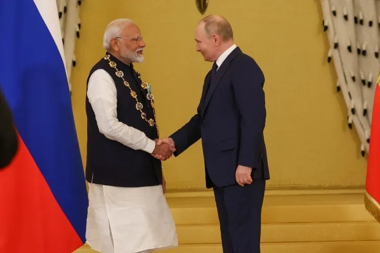 Narendra Modi and Vladimir Putin Shaking hands after the former was conferred Russia's highest award