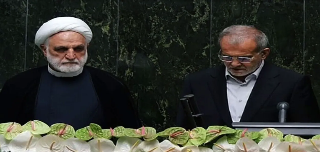 Iranian Parliament Speaker Mohammad Baqer Qalibaf administering oath to President Masoud Pezeshkian