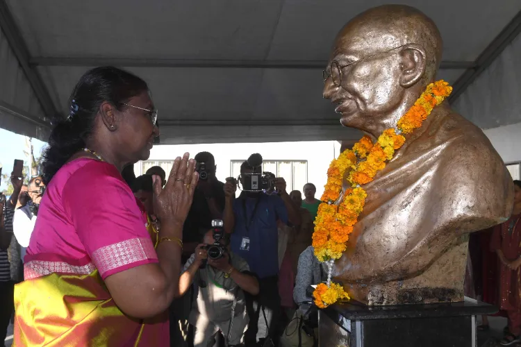 President Murmu pays floral tributes at the bust of Mahatma Gandhi in the Mahatma Gandhi Memorial High School, Suva