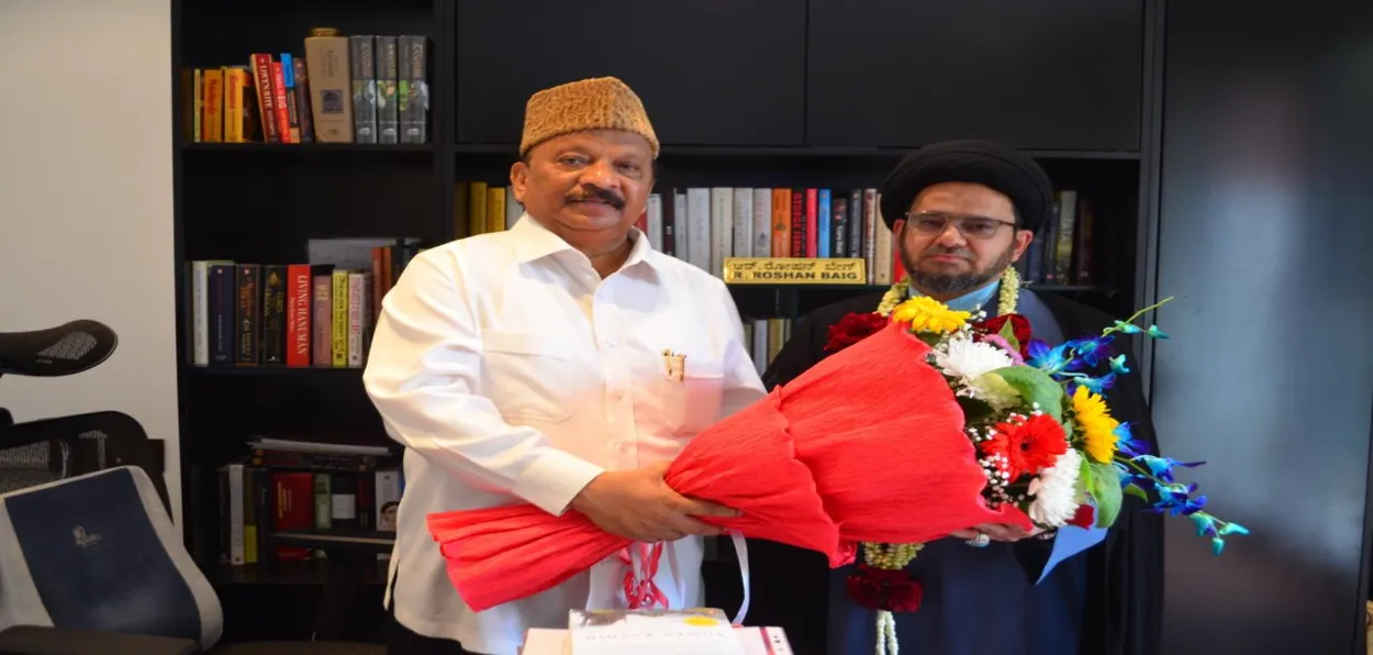 Karnataka former Home Minister Roshan Baig (Left) with an Islamic scholar