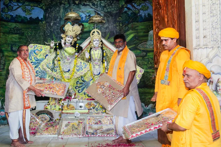 Priests during the Poshak Yatra  at Krishna Janmasthan Temple in Mathura on Sunday