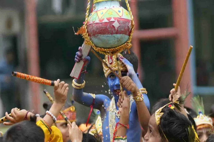 A boy dressed as Kanhaiya