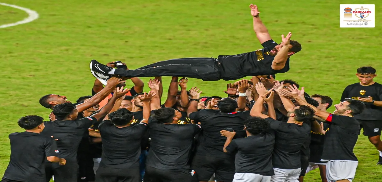 John Abraham being lifted by his players after the victory of NEUFC in Durand Cup