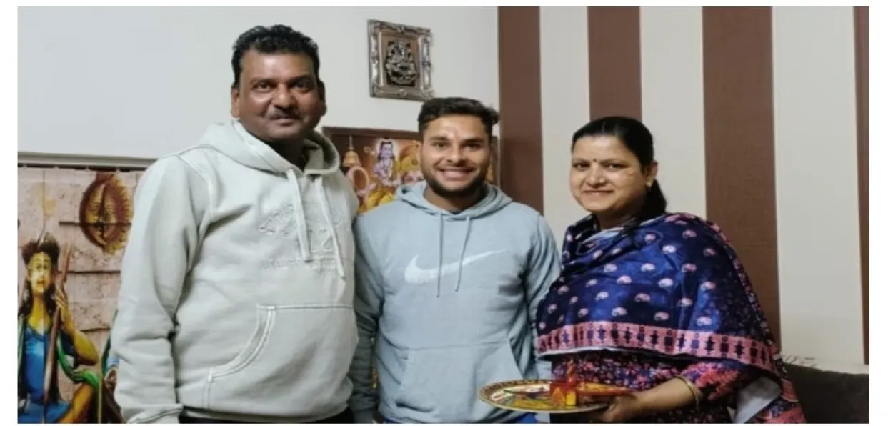 Mohammad Amaan with his coach Rajiv Goyal and his wife