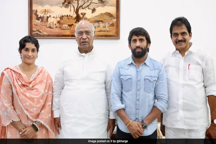 Wrestlers Bajrang Punia and Vinesh Phogat with Congress Chief Mallikarjun Kharge and KC Venugopal