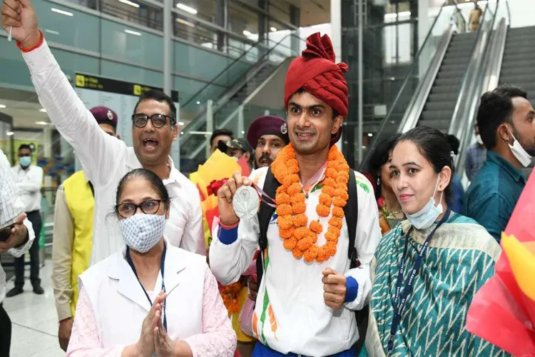 India's history-making Paralympians return to rousing reception