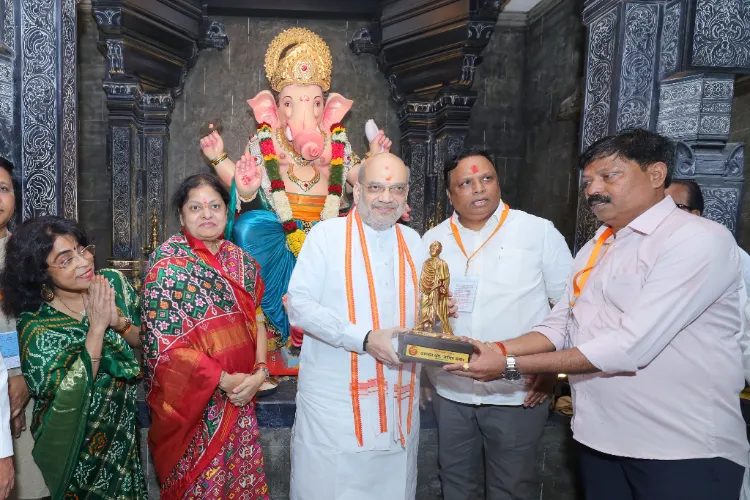 Home Minister Amit Shah and his  wife Sonal Shah offered prayers to Lord Ganesha