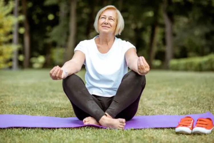 Elderly woman doing yoga