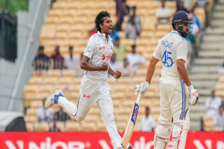 Bangladesh’s Hasan Mahmud celebrates the wicket of India’s captain Rohit Sharma 