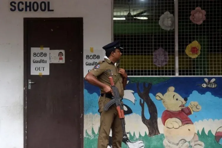 A Policeman guarding the polling station in a school in Colombo 