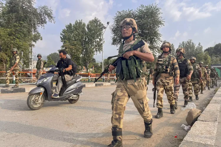 Security forces personnel conduct route march ahead of second phase of Jammu and Kashmir Assembly Elections, in Mendhar area of Poonch dist.