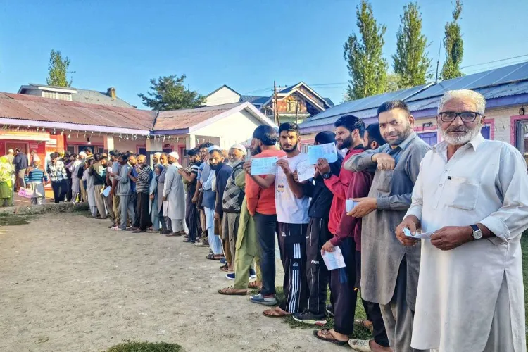 Voters queue at a polling station in J&K during the final phase of elections