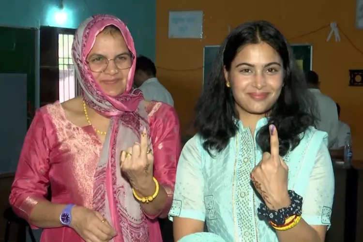 Olympic medallist Manu Bhaker, a first time voter, after casting her votes at their native village Goriya, Jhajjar and her mother in Haryana.