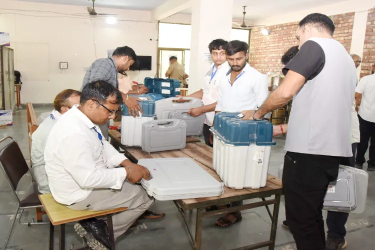 Polling officials are checking the Electronic Voting Machine (EVMs) at Sonipat