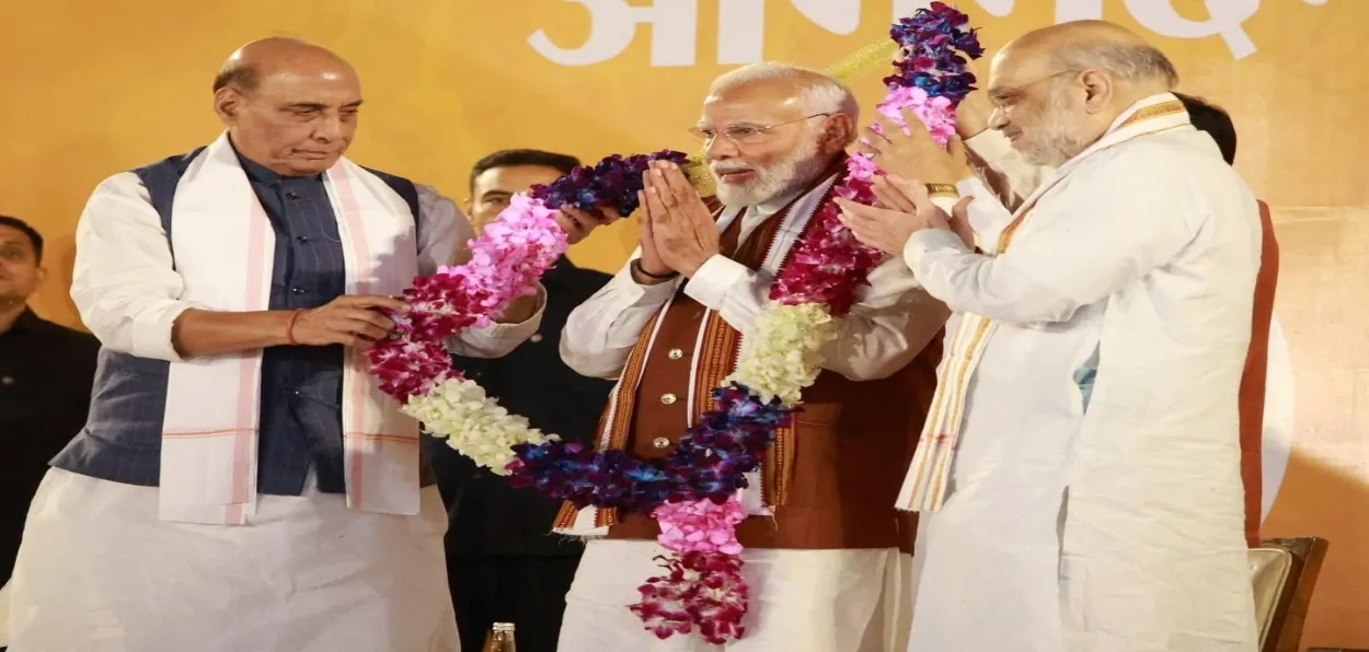 Prime Minister Narendra Modi is garlanded by Bharatiya Janata Party (BJP) National President JP Nadda