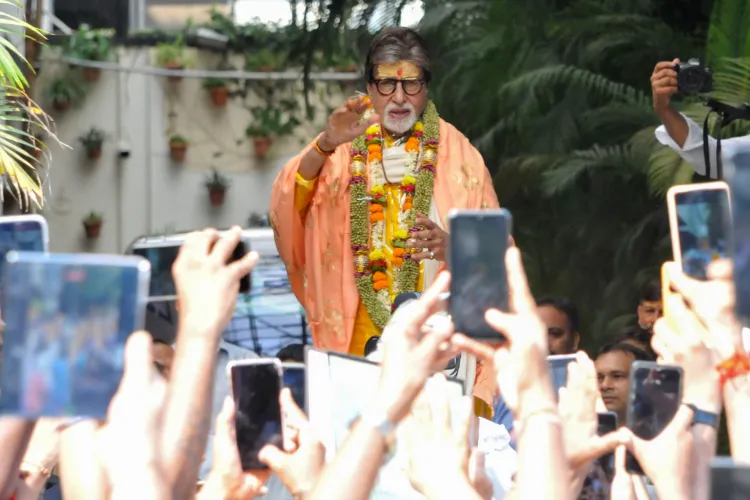 Actor Amitabh Bachchan greets his fans at his house