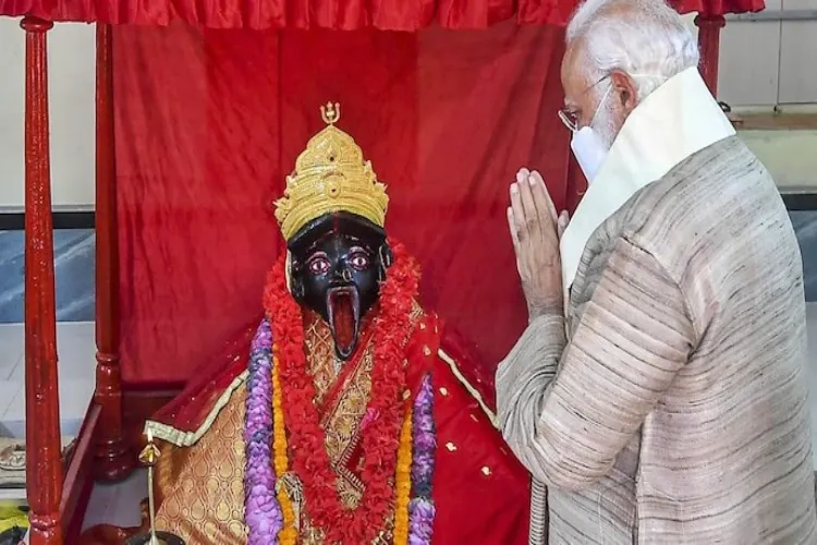 File picture of Prime Minister Narendra Modi praying at the Jeshoreshwari Kali temple