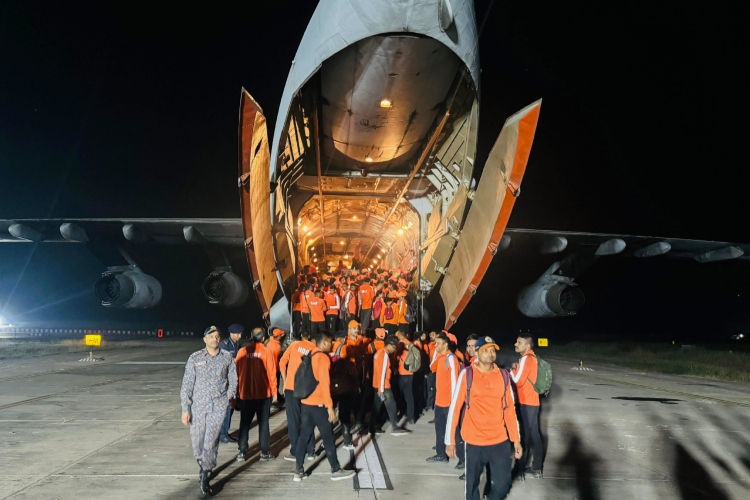 NDRF personnel alighting from a plane at a location in Odisha