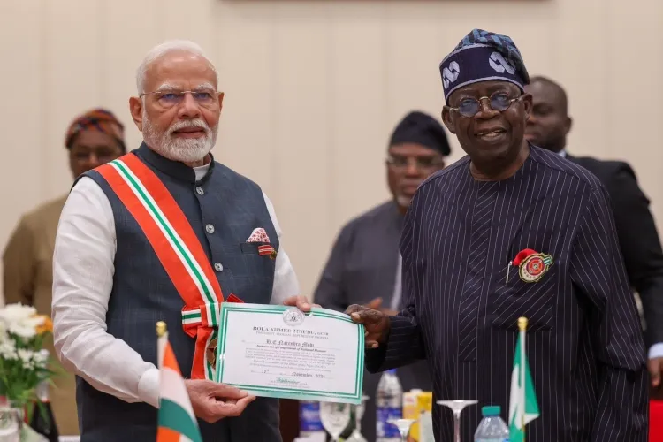 PM Narendra Modi with Nigerian President Bola Ahmed Tinubu after being conferred with the national honour of Nigeria