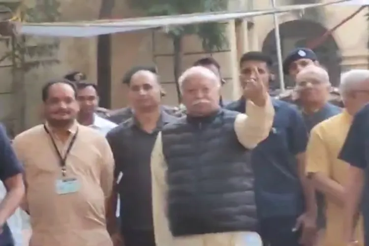 RSS Chief Mohan Bhagwat showing his finger mark after casting his votean Sohala