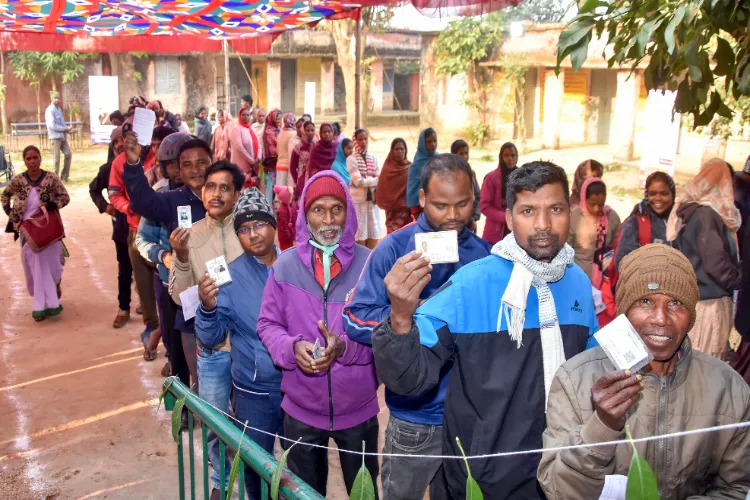 Ranchi: Tribal voters line up at a tribal model polling booth to cast their vote