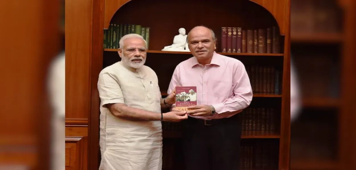 S M Khan presenting his book on APJ Abdul Kalam to Prime Minister Narendra Modi in Delhi