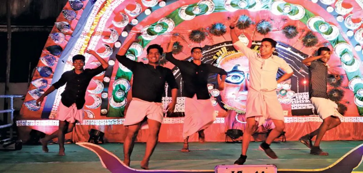 Young persons dancing ion a college festival in Kerala