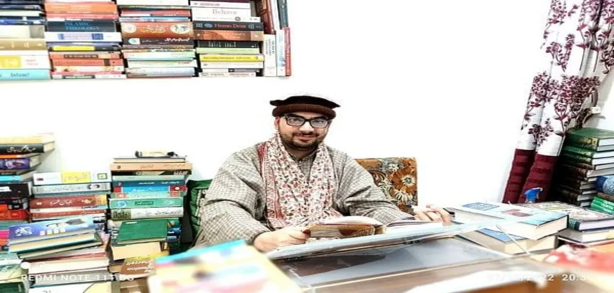 Author Amir Suhail Wani in his study in Srinagar